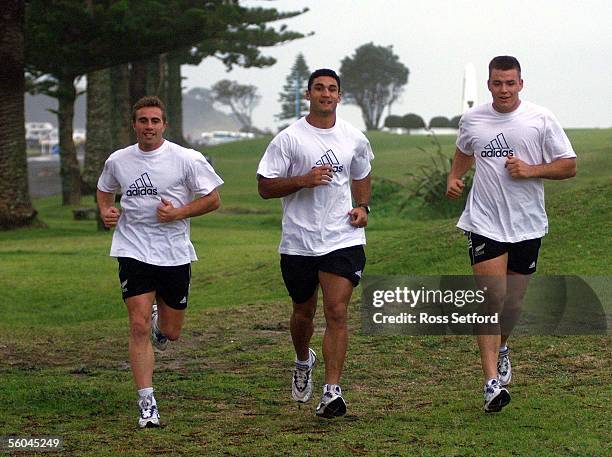 All Blacks Justin Marshall,Andrew Blowers and Royce Willis take a run along the Mt Maunganui beach after there arrival on Saturday.DIGITAL IMAGE.