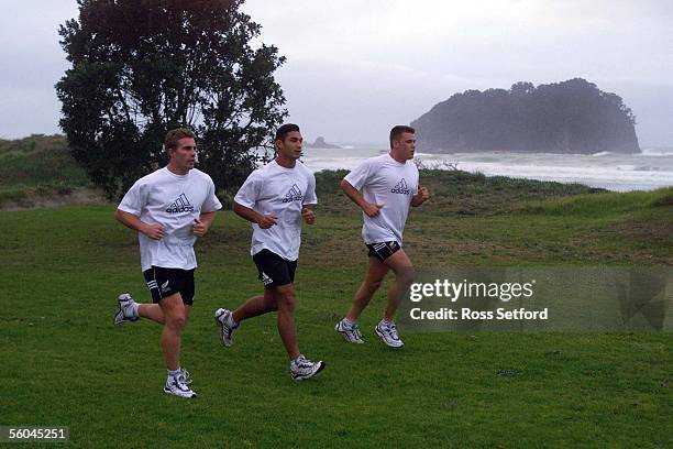 All Blacks Justin Marshall,Andrew Blowers and Royce Willis take a run along the Mt Maunganui beach after there arrival on Saturday.DIGITAL IMAGE.