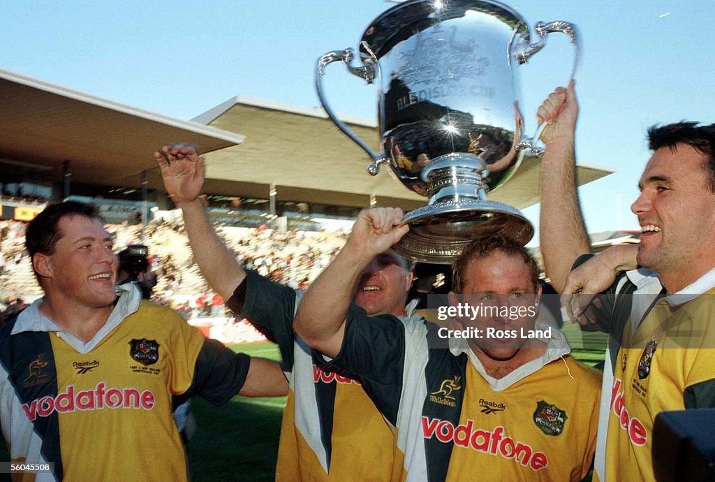 Victorious with the Bledisloe Cup are from left,Ph