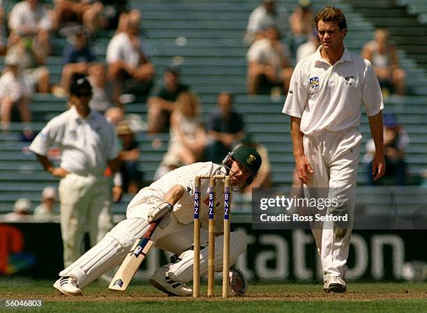 South Africa's Jonty Rhodes turns infront of New Zealand captain Dion Nash on the second day of the 1st test at Eden Park, Auckland.