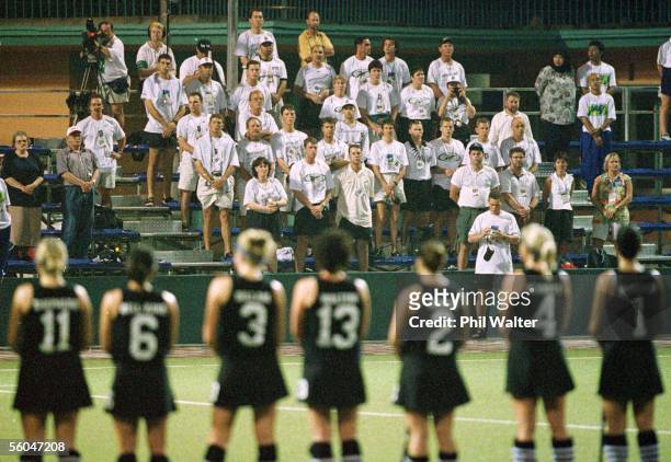 The mens hockey team are out in force to support their female counterparts as the National Anthem is sung before the Womans Hockey clash between NZ...