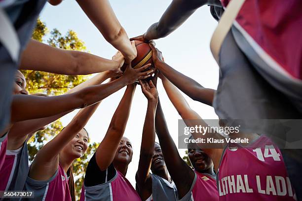 female basket team getting ready for a game - womens basketball stock-fotos und bilder