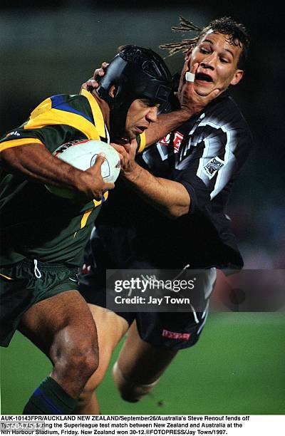 Australia's Steve Renouf fends off Tyran Smith during the Superleague test match between New Zealand and Australia at the Nth Harbour Stadium,...