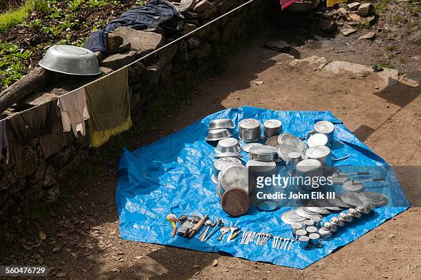 camp mess kit drying alongside everest trail - tarpaulin stock pictures, royalty-free photos & images