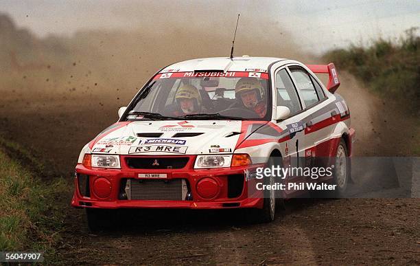Tommi Makinen of Finland manouvers his Mitsubishi Lancer Evo V through a corner with codriver Risto Mannisenmaki during the Shakedown for seeded...