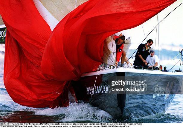 America True" bowperson Merrit Carey unhooks the spinaker aboard the team New Zealand Black Boat, during the San Francisco Yacht rnClubs win over the...