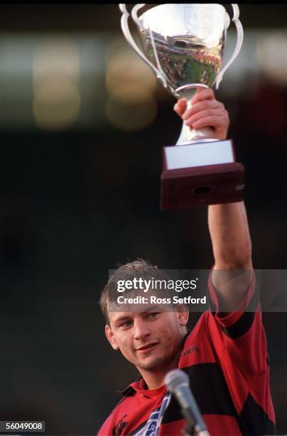 Canterbury Crusaders captain Todd Blackadder holds the Super 12 trophy aloft after the Crusaders beat the Auckland Blues 2013 in the Super 12 final...