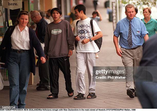 Asians mingle with New Zealanders in the main street of Howick.