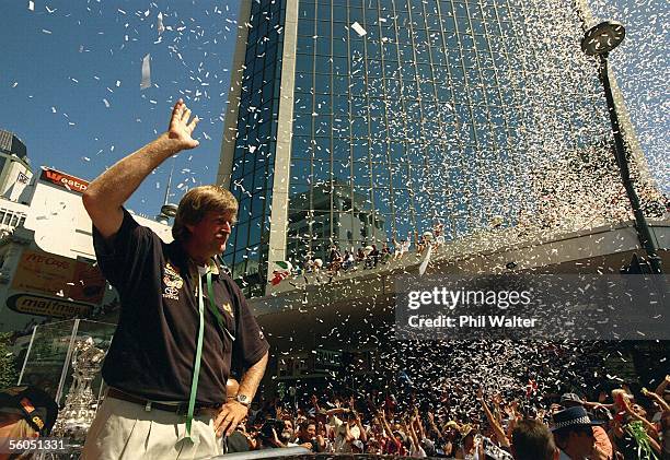 Team New Zealand's Sir Peter Blake is showered by ticker tape from the thousands of fans who turned out for their victory parade down Queen Street...