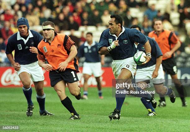 Manu Samoa's To'o Vaega makes a burst against Scotland in the quarter final play off match of the Rugby World Cup at Murrayfield, Edinburgh,...