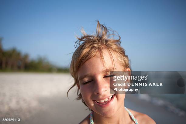girl at beach smiling with eyes closed - s good morning america 2010 stock pictures, royalty-free photos & images