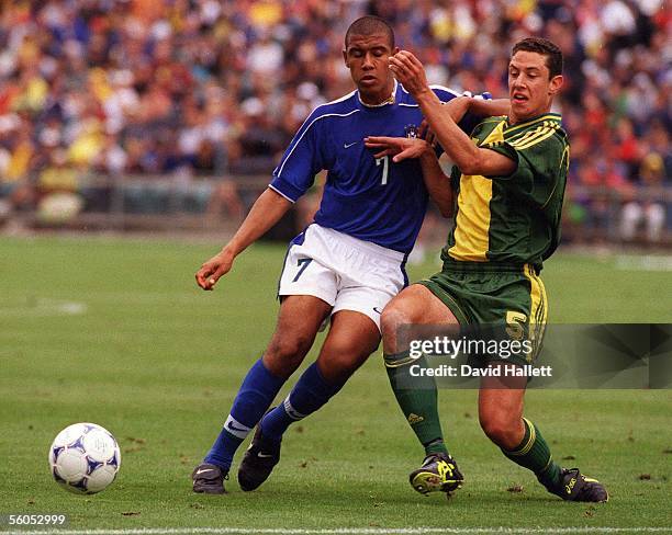 Brazil's Leo tackles Australia's Adrian Madaschi during the final of the FIFA Under 17 Soccer Wolrd Champs, Saturday.