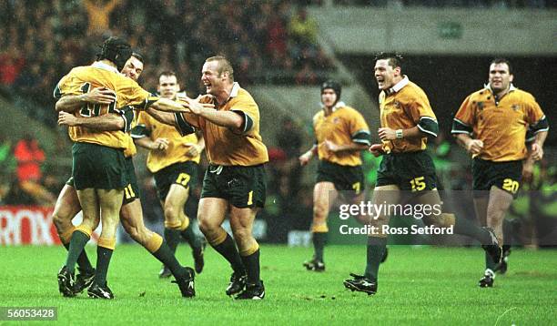 The Wallabies celebrate the drop goal of Stephen Larkham against the Springboks in the semi final of the Rugby World Cup at Twickenham on, Saturday....