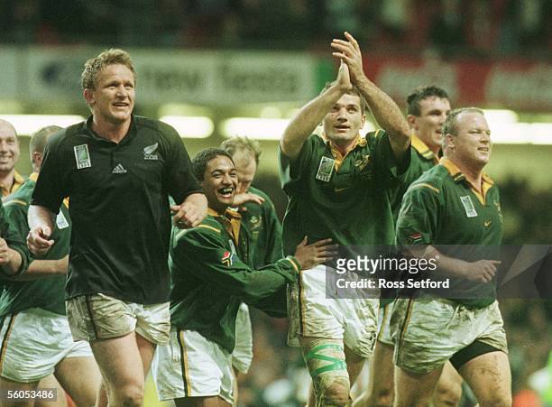 South Africa' s Andre Venter, left, Breyton Paulse and Joost van der Westhuizen after their win over New Zealand in the 3rd and 4th play off of the...