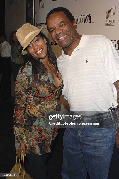 Actress Regina King and actor John Witherspoon attend the Los Angeles Launch Party For The TV Series "The Boondocks" at Mood on November 1, 2005 in...