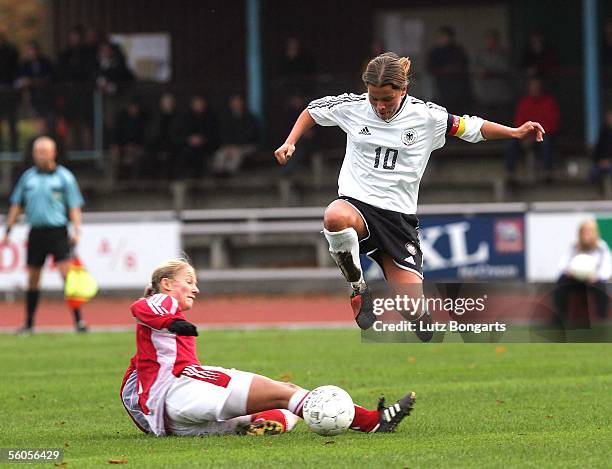 Patricia Hanebeck of Germany and Janni Arnth of Denmark challenge for the ball during the women's friendly match between U21 Denmark and U20 Germany...