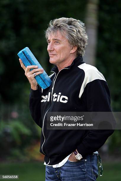 Musical artist Rod Stewart signs the symbolic blue brick as he records his contribution to the disaster relief charity single, a cover of the Sir...