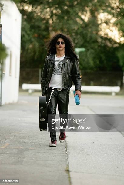 Slash of Velvet Revolver walks with the symbolic blue brick as they record and film the video for the new disaster relief charity single, a cover of...