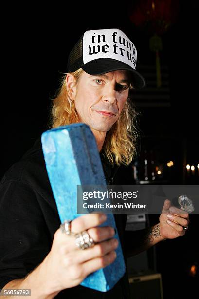 Duff McKagan of Velvet Revolver signs the symbolic blue brick as they record and film the video for the new disaster relief charity single, a cover...