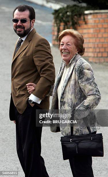 Princess Letizia's father Jesus Ortiz and grandmother Menchu Alvarez smile as they arrive to visit Letizia and her new daughter Leonor at the Ruber...