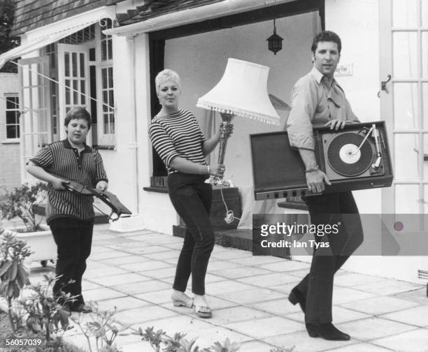 Welsh singer Tom Jones and his family, wife Linda and son Mark, moving into their new home Sunbury in Surrey, 21st July 1967.