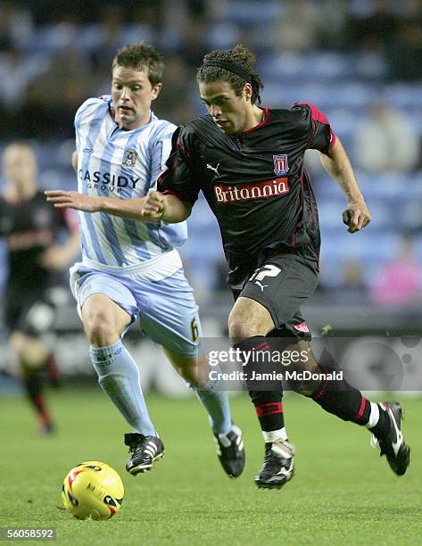 Darel Russell of Stoke outpaces Stephen Hughes of Coventry during the Coca Cola Championship match between Coventry City and Stoke City at the Ricoh...