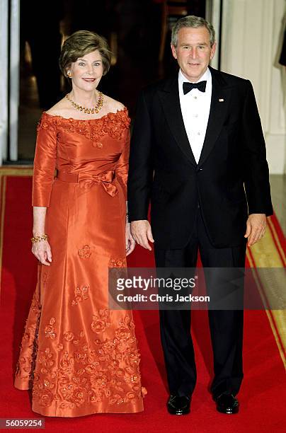 President George W. Bush and first lady Laura Bush arrive for the social dinner at the White House on the second day of the royals' eight-day visit...