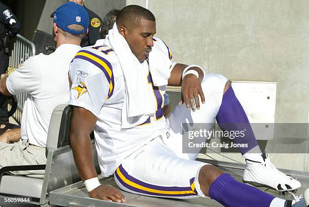 Quarterback Daunte Culpepper of the Minnesota Vikings is carted off the field after being injured against the Carolina Panthers at Bank of America...