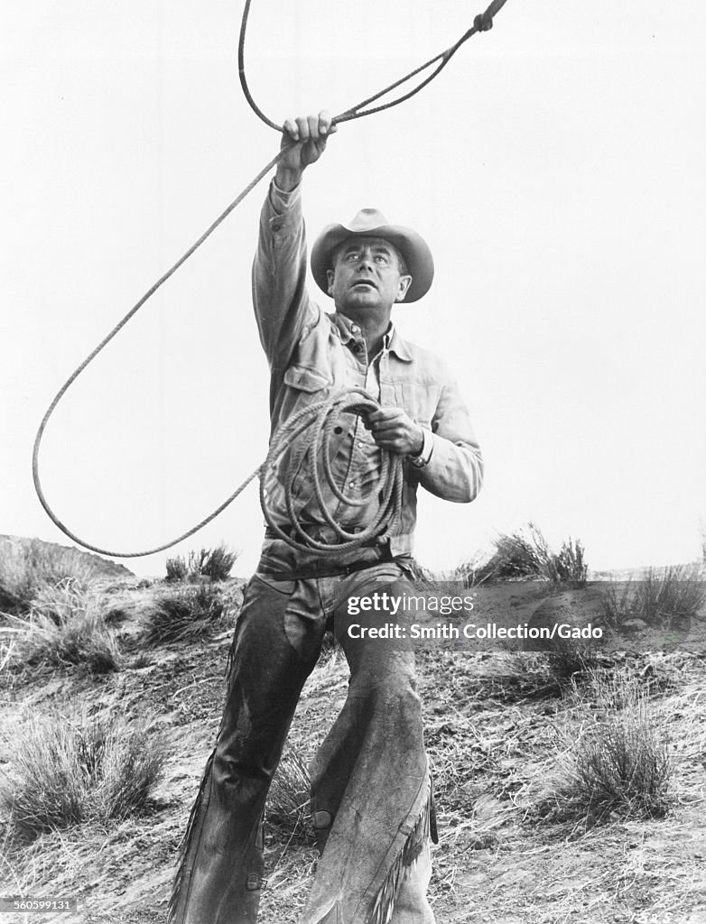 Glenn Ford with a lasso and cowboy hat, June, News Photo