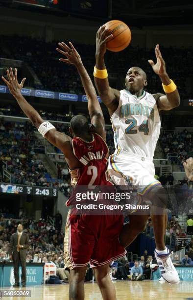 Desmond Mason of the New Orleans/Oklahoma City Hornets shoots against Donyell Marshall of the Cleveland Cavaliers November 2, 2005 in Cleveland,...