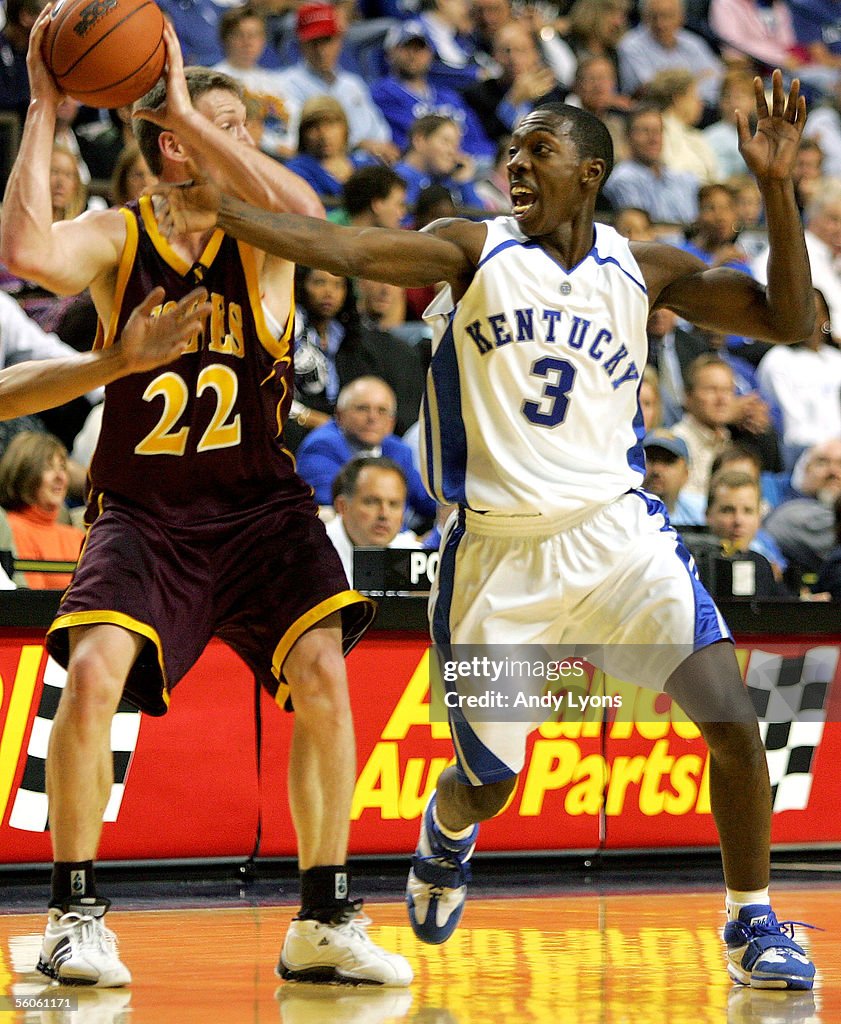 Ramel Bradley of the Kentucky Wildcats reaches for the ball held by ...
