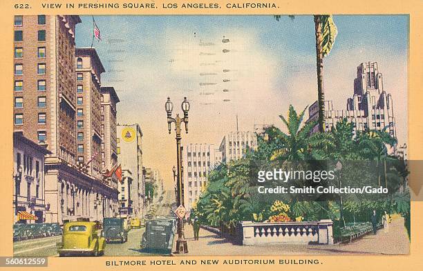 Biltmore Hotel and auditorium building, as seen from Pershing Square, with cars and a street, Los Angeles, California, 1935.