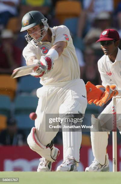 Shane Watson of Australia hits out during day one of the 1st Test between Australia and the West Indies at the Gabba on November 3, 2005 in Brisbane,...