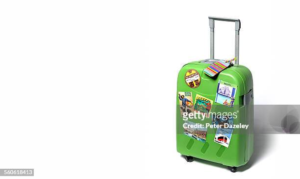 travel suitcase with travel stickers - maleta fotografías e imágenes de stock