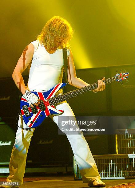 Guitarist Rick Savage of Def Leppard performs on stage in Tingley Coliseum on November 2, 2005 in Albuquerque, New Mexico.