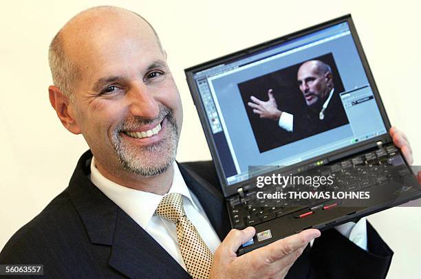 Germany: Bruce Chizen, CEO of Adobe Systems, holds a computer where a picture of him is displayed with the program Adobe Photoshop, 03 November 2005...