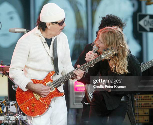 Musician Carlos Santana and singer Walt Lafty make an appearance on Good Morning America to help celebrate their 30th anniversary on November 3, 2005...