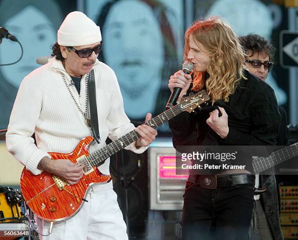 Musician Carlos Santana and singer Walt Lafty make an appearance on Good Morning America to help celebrate their 30th anniversary on November 3, 2005...
