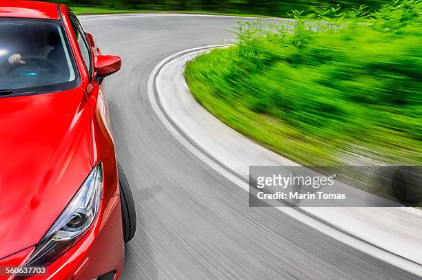 car driving - ワインディングロード　車 ストックフォトと画像