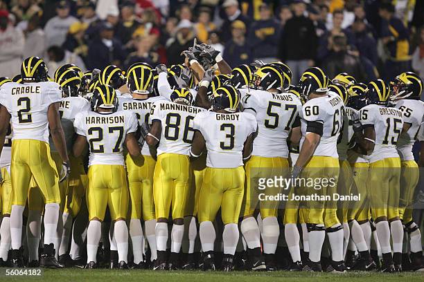 The Michigan Wolverines huddle before the game against the Northwestern Wildcats on October 29, 2005 at Ryan Field at Northwestern University in...