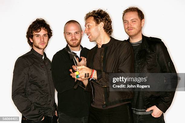 Guy Berryman, Will Champion, Chris Martin and Jonny Buckland of Coldplay, nominated for the award for Best Album, pose for a portrait in the...