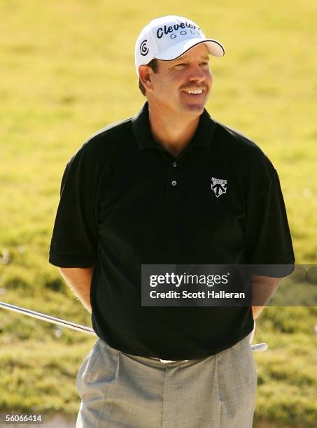 Bart Bryant smiles after hitting the pin with his pitch shot on the 17th hole during the first round of the PGA Tour Championship at East Lake Golf...