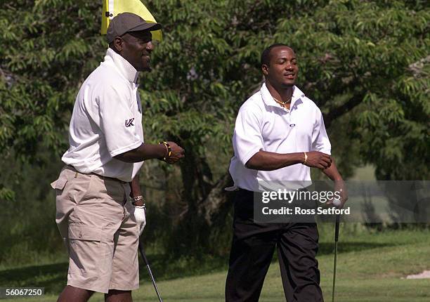West Indies coach Sir Viv Richards, left, drops a shot to his team captain Brian Lara on the first hole at the Wairakei International Course,...