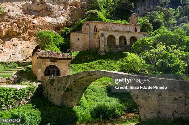 church and bridge of tobera- burgos-spain - godsdienstige gebouwen stockfoto's en -beelden