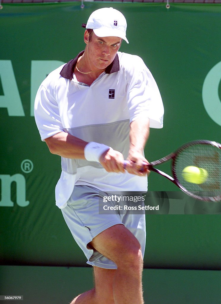 Sweden's Magnus Norman plays a backhand against Ar