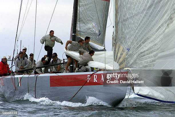 The crew on Prada work to gather in the spinnaker against AmericaOne during their 2nd race in the Louis Vuitton Challenge Final held on the Waitemata...