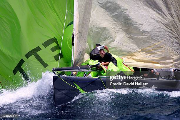 AmericaOne crew struggle to bring in the spinnaker as they round the bottom mark against Prada in the fifth race of the Louis Vuitton final on the...