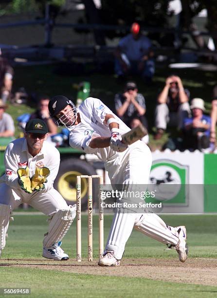 New Zealand's Adam Parore cracks a six down the pitch against Australia on the first day of the second test in the National Bank series at the Basin...