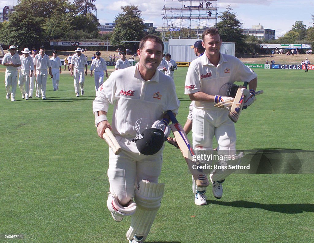 Australia's Justin Langer, left and Adam Gilchrist