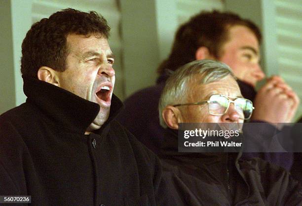 Yawning All Black coach Wayne Smith, left and former All Black manager John Sturgeon, watch the Ranfurly Shield match between the West Coast and...